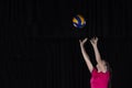 Young woman volleyball player isolated on black background Royalty Free Stock Photo