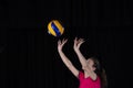 Young woman volleyball player isolated on black background Royalty Free Stock Photo