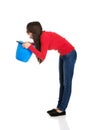 Young woman vomiting to bucket. Royalty Free Stock Photo