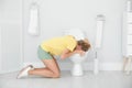Young woman vomiting in toilet bowl Royalty Free Stock Photo