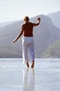 Young woman wading in lake