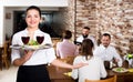 Female waiter showing country restaurant Royalty Free Stock Photo