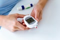 Young woman waiting for the result of the glucose test on the glucometer. Royalty Free Stock Photo