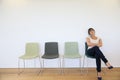 Young woman in waiting room Royalty Free Stock Photo