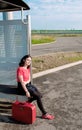 Young woman waiting in a station Royalty Free Stock Photo