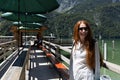 Young woman waiting to board a boat on the lake Royalty Free Stock Photo