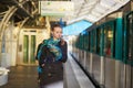 Young woman waiting for a train on the platform of Parisian underground Royalty Free Stock Photo