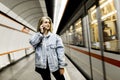 Young woman waiting train in underground Royalty Free Stock Photo