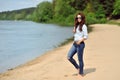 Young woman walkin on a beach