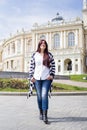 Young woman walkin in the street of old city