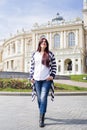 Young woman walkin in the street of old city