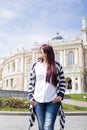 Young woman walkin in the street of old city