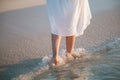 Young woman walking along the seacoast Royalty Free Stock Photo