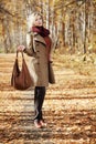 Young woman walking in autumn forest Royalty Free Stock Photo