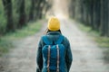 Young woman walking on an avenue on her travel journey