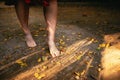 Young woman walking barefoot through autumn leaves Royalty Free Stock Photo