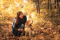 Young woman walking with a beagle