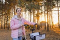 Young woman walking with bicycle in autumn city park Royalty Free Stock Photo