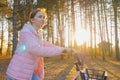 Young woman walking with bicycle in autumn city park Royalty Free Stock Photo