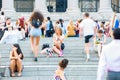 Young woman walking blurred image. Londoners at warm summer day. UK, London