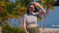 Young woman walking on a Carribean Paradise beach Royalty Free Stock Photo