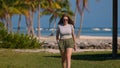 Young woman walking on a Carribean Paradise beach Royalty Free Stock Photo