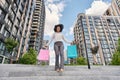 Young woman walking with colorful shopping bags Royalty Free Stock Photo