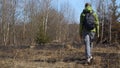 Young woman walking in coppice