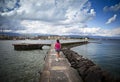 Young woman walking in the dock Royalty Free Stock Photo