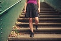 Young woman walking down stairs Royalty Free Stock Photo