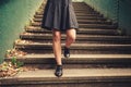 Young woman walking down stairs Royalty Free Stock Photo