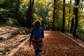 Young woman walking in forest. Adventure style. Autumn colours. Beautiful nature and young girl. Royalty Free Stock Photo