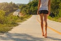 Young woman walking on highway Royalty Free Stock Photo