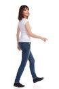 Young Woman Is Walking And Looking At Camera Over The Shoulder Royalty Free Stock Photo