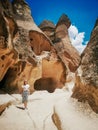 Young woman walking among Pasabag valley in Cappadocia.