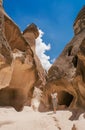 Young woman walking among Pasabag valley in Cappadocia.