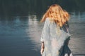 Young woman walking at river alone Royalty Free Stock Photo