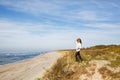 Young woman walking on the seacoast Royalty Free Stock Photo