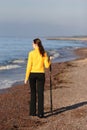 Young woman walking on a seaside