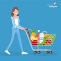 Young woman walking with shopping cart.