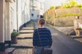 Young woman walking in small town Royalty Free Stock Photo