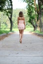young woman walking on the summer park Royalty Free Stock Photo