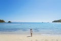 Young woman walking toward the beach Royalty Free Stock Photo