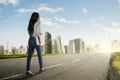 Young woman walking toward better future Royalty Free Stock Photo