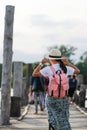 Young woman walking in U bein bridge at sunset, Asian traveler traveling near Amarapura in Myanmar Burma. Landmark and popular Royalty Free Stock Photo