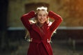 Young woman walking wearing red coat Royalty Free Stock Photo