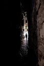 Young Woman Walks Alone Through Spooky Narrow Abandoned Alley In The Night Royalty Free Stock Photo