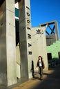 A young woman walks through the Edgemar Shopping Center