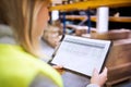 Young woman warehouse worker. Royalty Free Stock Photo