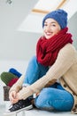 Young woman in warm hand knitted hat at home Royalty Free Stock Photo